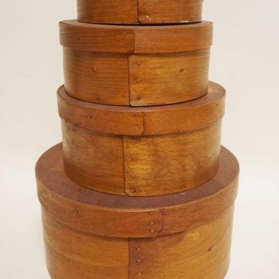 1051	NEST OF 4 ROUND BOXES, LARGEST APPROXIMATELY 10 IN X 5 IN
