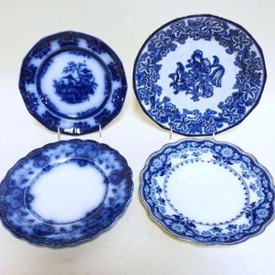 1090	GROUP OF 4 FLOW BLUE PLATES, LARGEST APPROXIMATELY 10 1/2 IN
