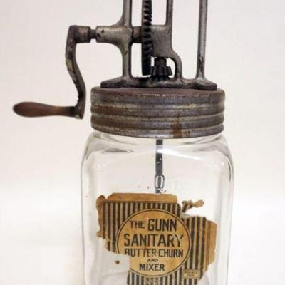 1016	ANTIQUE GLASS 2 QUART BUTTER CHURN *THE GUNN* APPROXIMATELY 13 IN HIGH
