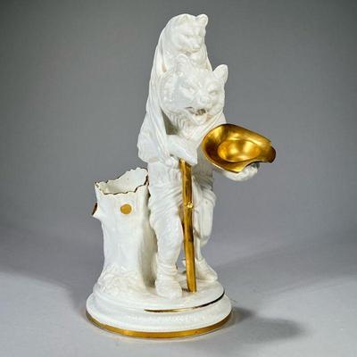 ANTIQUE CERAMIC BEARS | White ceramic bears showing a standing bear with a gilt hat and cane with a bear cub on his shoulders. - h. 14 in

