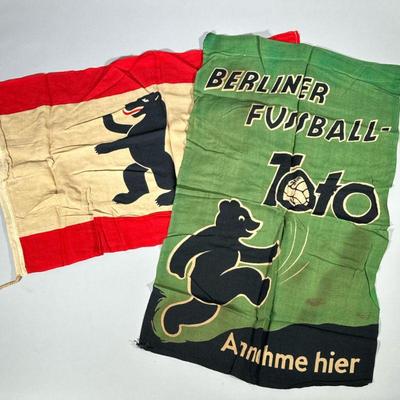 (2pc) ANTIQUE GERMAN LINEN BEAR FLAGS | Including Berliner Fussball “Toto” Annahme hier, plus a flag with rampant bear. - l. 30 in (each,...