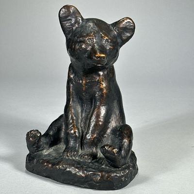 YAN MAC LEOD BEAR FIGURINE | Bronze painted ceramic bear figurine reproduction of Yan MacLeod sculpture. - l. 7 x w. 5.75 x h. 10.25 in

