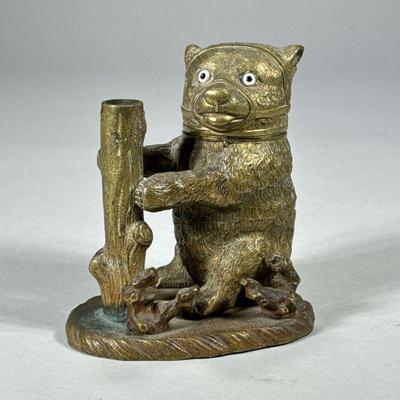 BRONZE BEAR INKWELL | Bronze bear inkwell with flip top head and quill holder. - l. 4.75 x w. 3 x h. 5 in

