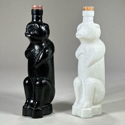 (2pc) PAIR EARLY BEAR FORM GLASS BOTTLES | One black and one white standing bear bottle, each marked "R776" on bottom.

