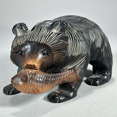 CARVED WOOD BEAR | Carved wood bear with fish figurine. - l. 9 x w. 4.5 x h. 5 in

