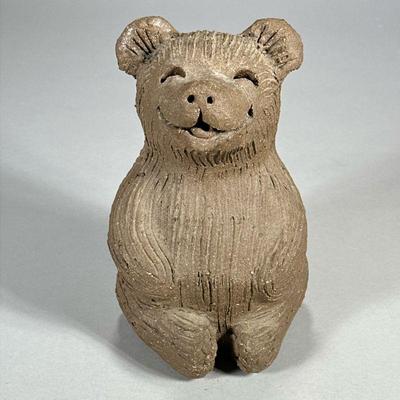 CLAY BEAR FIGURINE | Seated clay bear figurine with big smile, signed on bottom. - l. 5.25 x w. 5.5 x h. 8.75 in

