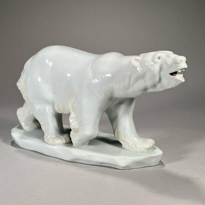 LARGE HEREND CERAMIC POLAR BEAR | Gyula Maugsch, 20th century with impressed signature on the base and Herend marks underneath. - l. 16 x...
