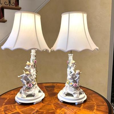 LOT 717 Pair of Porcelain Cherub Figural Lamps by Schierholz. Click here to...
