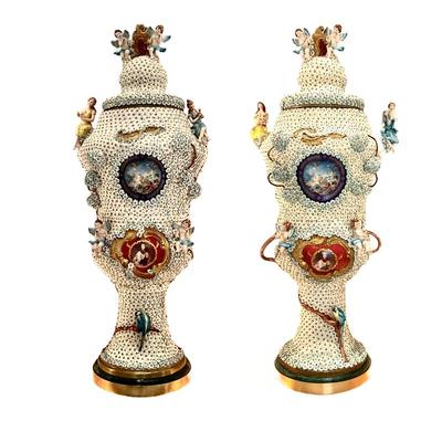 LOT 712 Pair of Monumental Hand Painted Porcelain Flower Encrusted "Cherub Vases"
Click Here to...