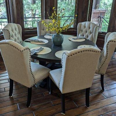 Dining table with 4 studded wingback chairs