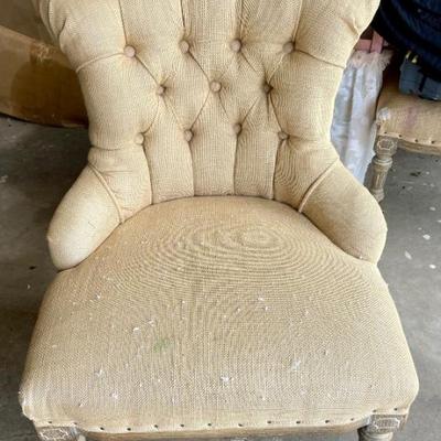 One of two vintage children’s wingback chairs 