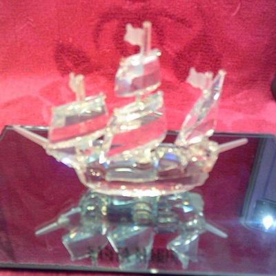 https://www.agesagoestatesales.com/product/vintage-swarovski-silver-crystal-santa-maria-ship-includes-mirror/1060
