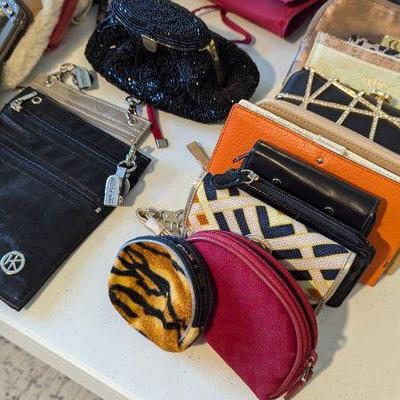 Small makeup bags and wallets, including Kate Spade