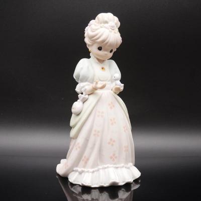Precious Moments 1997 "Charity Begins in the Heart" Bisque Porcelain Figurine