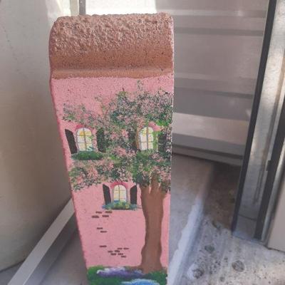 Painted brick doorstop as a Charleston single house