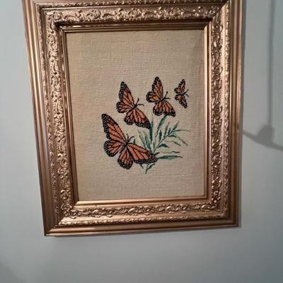 Framed needlepoint of Monarch butterflues