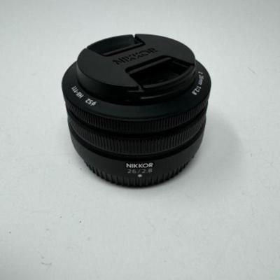 ﻿Nikon Nikkor Z 26Mm F/2.8 Interchangeable Lens + HB-111 Hood | Est. $635	