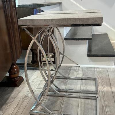 Two  chrome side tables
18” deep x 10” wide x 24” tall $50
