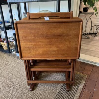 Vintage teak TV tray tables by Goodwood. Set of four with rack.