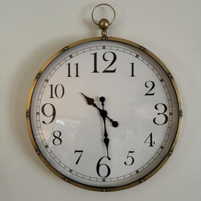 Large decorative wall clock measures 27” in diameter. 