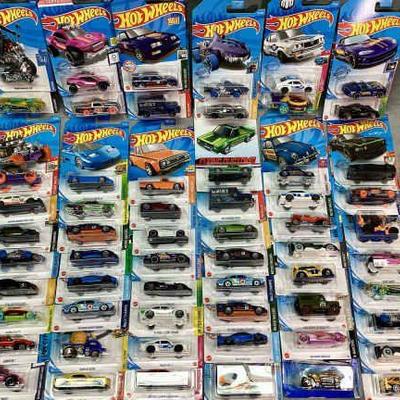 KIHE702 Large Lot 76 HotWheels	Large assortment, all still in original packaging. 
