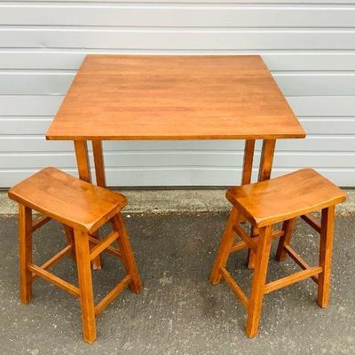 DEJE601 Wooden Bar Table With Stools	This lot includes a collapsing wooden bar table(36x36x36) with two stools(H23.5xL17.5) ,marked made...