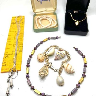 (5) Costume Jewelry Necklaces & Bracelets
No maker's marks found. Silver tone necklace was found wrapped up with the Act II High...