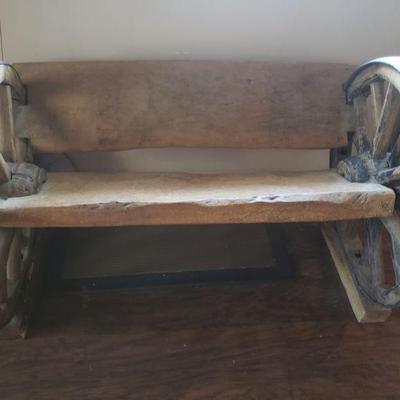 Handmade wagon wheel bench