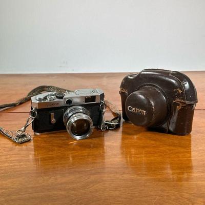 VINTAGE CANON CAMERA | Canon model no. 761482 film camera with Nokton 1:1.5/50 lens and leather carrying case. - l. 7 x w. 4 x h. 5 in

