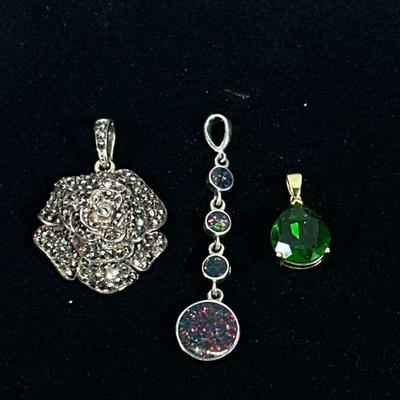 OPAL & STERLING AND OTHER PENDANTS | Designed as a sterling silver pendant with mounted circular opals marked "STER"...