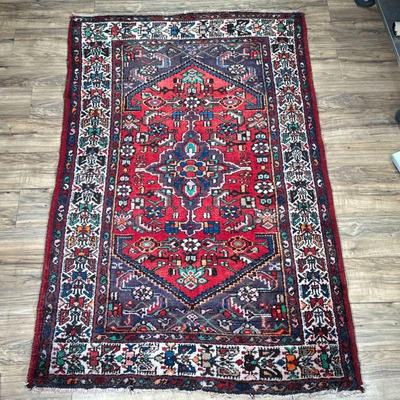 GEOMETRIC CAUCASIAN RUG | Having deep red backing with colorful central medallion and geometric border. - l. 78 x w. 50 in


