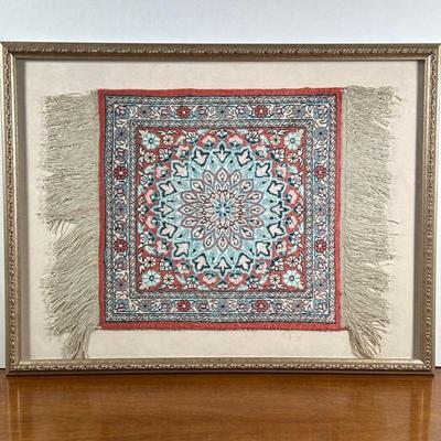 FRAMED MINIATURE RUG | Having colorful central medallion with flower border. - l. 21 x w. 16 in

