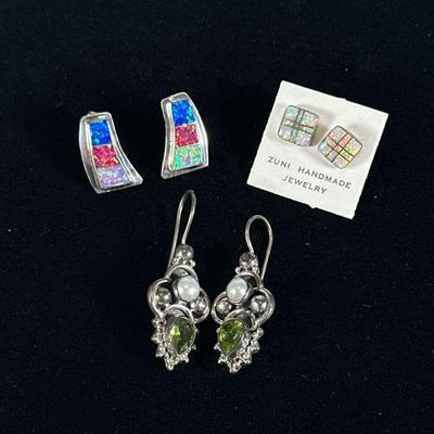 (3pc) OPAL STERLING & OTHER EARRINGS | Designed as a pair of sterling silver with inlaid opal studs marked on back...