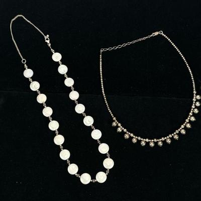 (2pc) PEARL & STERLING SILVER NECKLACES | Designed as a sterling silver necklace with 19 1/2" flat pearls marked "925"...