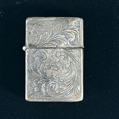ANTIQUE SILVER ZIPPO STYLE LIGHTER | Having flower engraving. - l. 2.25 x w. 1.5 in

