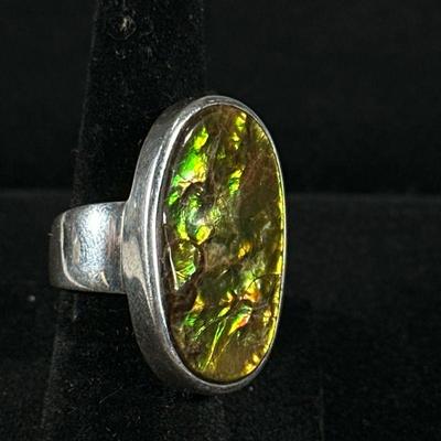 OPALIZED AMMONITE & STERLING RING | Designed as a sterling silver ring with mounted opalized ammonite fossil, size 5, marked “VG 925”...