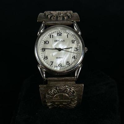 ANASAZI WRISTWATCH WITH STERLING BAND | Anasazi Quartz watch with mother of pearl dial and native folk art design band marked...