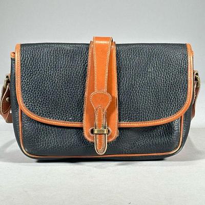 DOONEY & BOURKE BLACK LEATHER PURSE | Dooney & Bourke All Weather Leather black purse with caramel leather trim. - l. 11 x w. 3.5 x h....