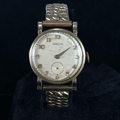 HAMILTON 14K GOLD FILLED WRISTWATCH | Hamilton 14k gold filled wristwatch with flexible metal band marked "14K GOLD FILLED".

