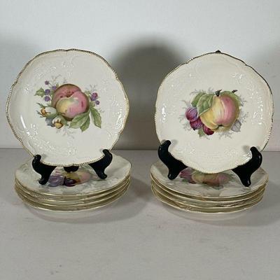 (10pc) ROSENTHAL IVORY PORCELAIN PLATES | Having fruit medallion in center with gilt border. - dia. 8.5 in

