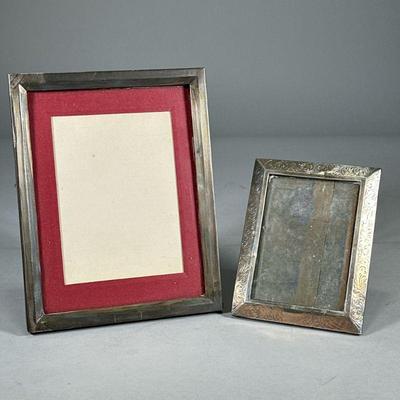 (2pc) STERLING SILVER PICTURE FRAMES | Each stamped "Sterling", including a 3.5 x 5 frame with engraved scroll design and a 6 x...