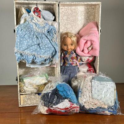 LARGE LOT DOLL CLOTHING | Large lot of doll clothing with doll in compact carrying case. - l. 22 x w. 8.5 x h. 8.5 in

