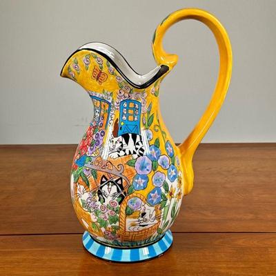 CATZILLA WATER PITCHER | Colorfully glazed water pitcher marked on bottom “Catzilla / Candace Reita”. - h. 14.5 x dia. 8 in

