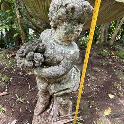 TTT059- Braden Statue Of Boy Holding Something