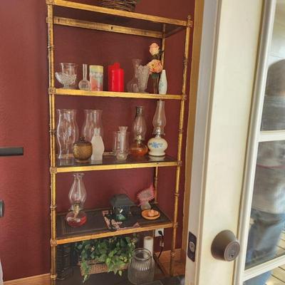 Bookcases filled with oil lamps