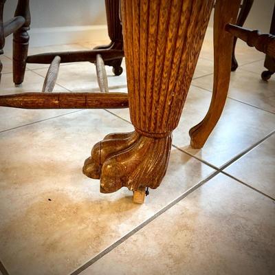Antique dining table with 2 leaves and claw feet