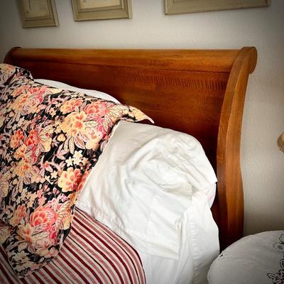 Queen-size sleigh bed with hidden cedar drawer