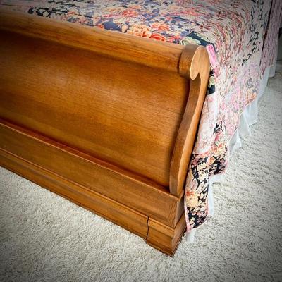 Queen-size sleigh bed with hidden cedar drawer