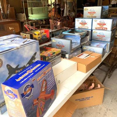 Collection of NIB die cast cars and airplanes