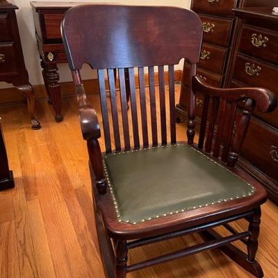 Antique rocker w/leather seat $80
